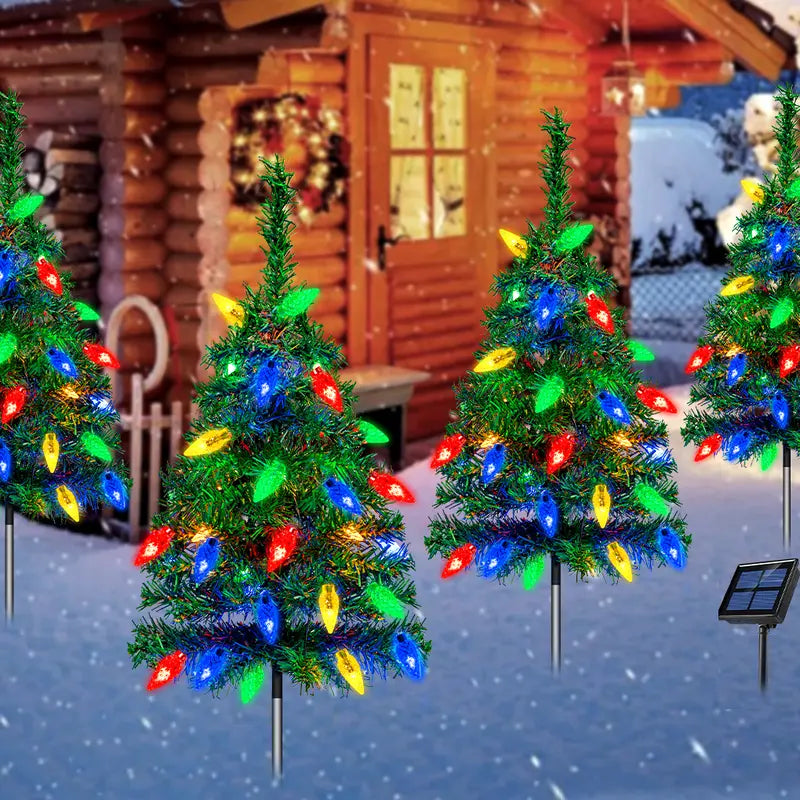 Four solar Christmas tree stake lights with multicolor bulbs