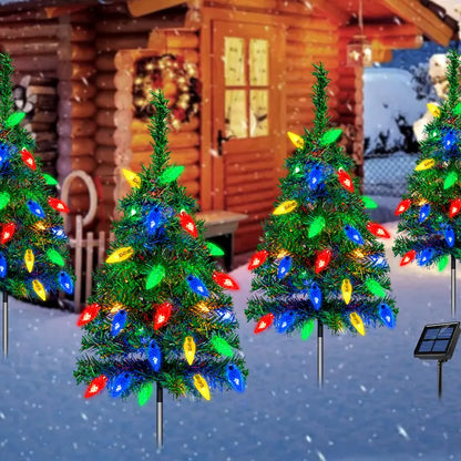 Four solar Christmas tree stake lights with multicolor bulbs