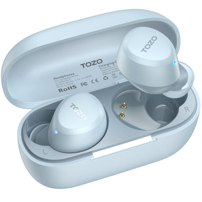 TOZO branded true wireless earbuds in light blue, shown in open charging case. Both earbuds display blue LED indicators. Case interior shows gold charging pins and L\/R labels. Case lid shows regulatory text and RoHS markings.