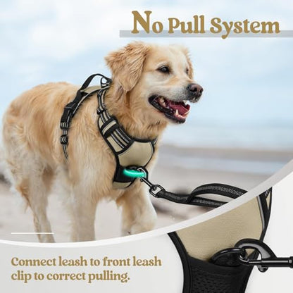 Golden retriever wearing a beige and black no-pull dog harness on a beach. Text reads 'No Pull System' and 'Connect leash to front leash clip to correct pulling.' A close-up inset shows the front clip detail.