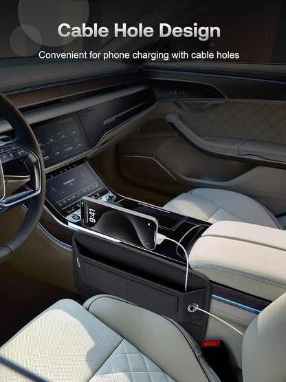 Black leather car seat gap filler organizer shown in a luxury car interior, positioned between the seat and center console. A phone displaying 9:41 is visible inside, with a charging cable routed through the organizer's cable hole.