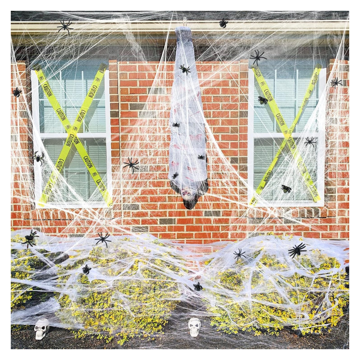 Large stretchable spider web material and decoration example; store packs include 100 spiders per web pack, other props not included.