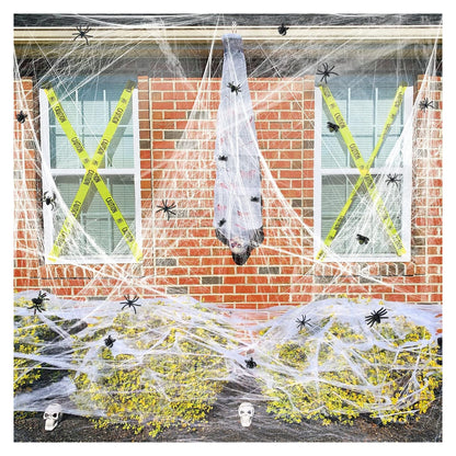 Large stretchable spider web material and decoration example; store packs include 100 spiders per web pack, other props not included.