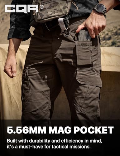 CQR tactical cargo pants in dark brown, shown on a person inserting a magazine into a side cargo pocket. Text reads '5.56MM MAG POCKET - Built with durability and efficiency in mind, it's a must-have for tactical missions.'