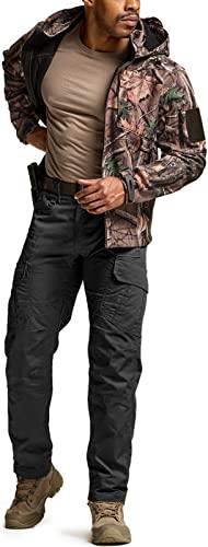 Man wearing black tactical cargo pants with multiple pockets, paired with a camo jacket and tan shirt. Pants feature side cargo pockets and a dark belt. Shown from front in a standing pose with tan boots.