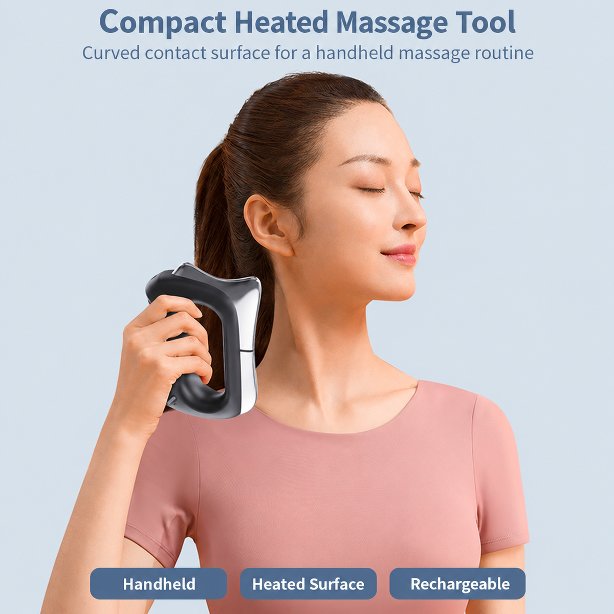Handheld heated massage tool in use