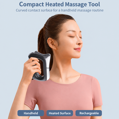 Handheld heated massage tool in use