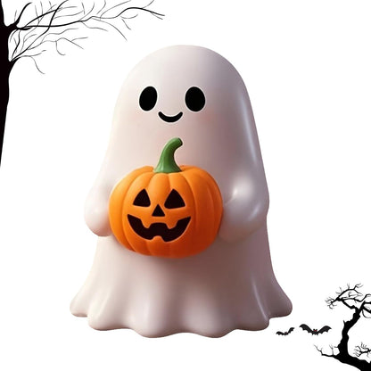 Cute white ghost figurine holding an orange jack-o'-lantern pumpkin with a green stem. The ghost has a friendly smiling face with black oval eyes. Halloween-themed silhouette trees and bats decorate the white background.