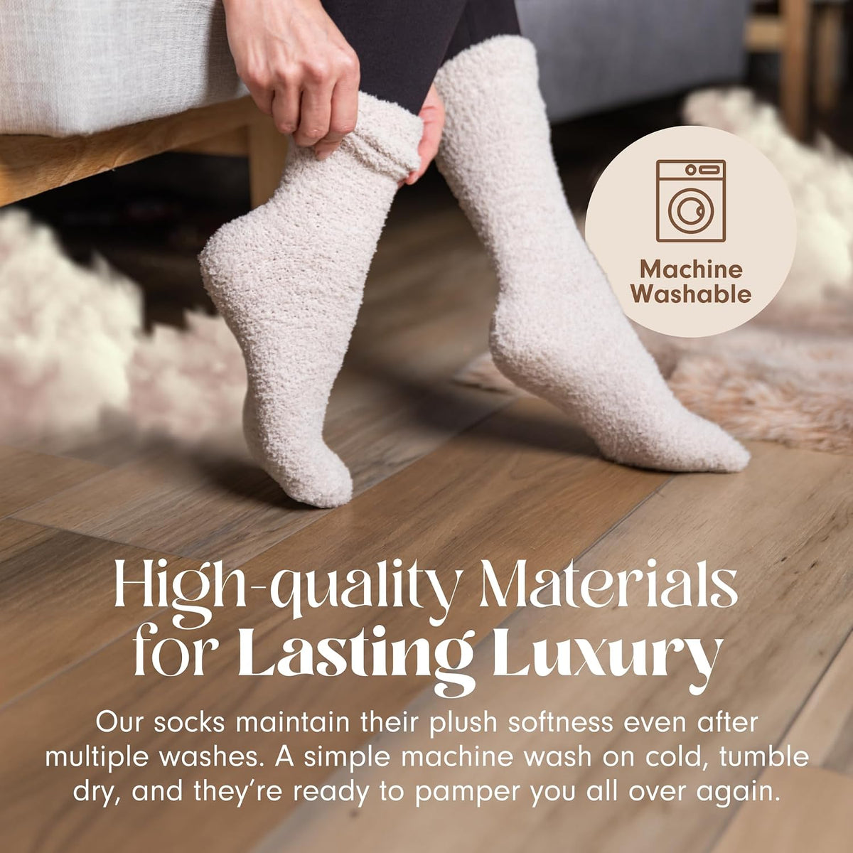 Person pulling on a fluffy cream-colored cloud sock while seated, with a second sock-clad foot on a wood floor. A ''Machine Washable'' badge appears top right. Text reads: ''High-quality Materials for Lasting Luxury'' with care instructions below.