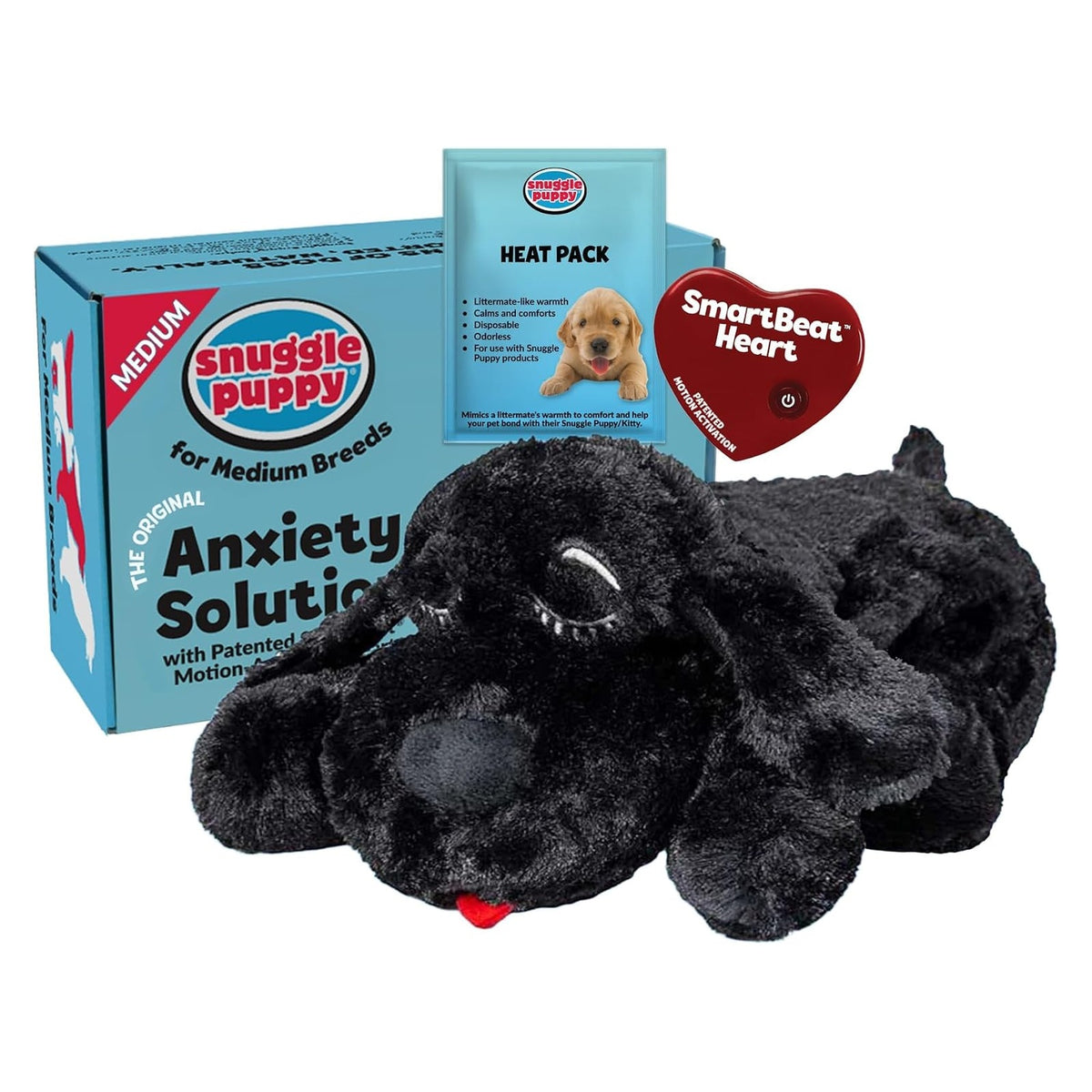 Snuggle Puppy behavioral aid toy set showing a black plush dog lying down, with a teal 'Anxiety Solution for Medium Breeds' box, a SmartBeat Heart tag, and a Heat Pack pouch.