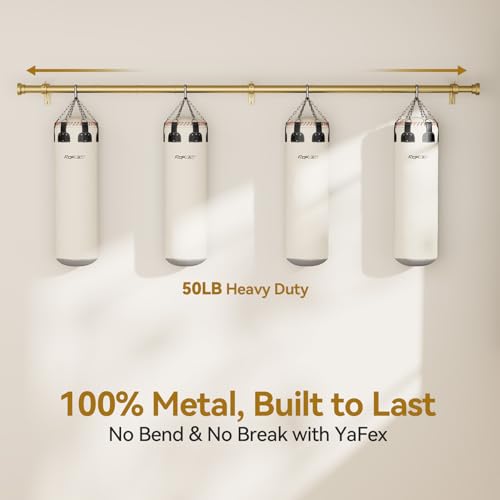 Gold metal curtain rod mounted on a beige wall, supporting four white punching bags labeled 'RokJax' to demonstrate 50LB heavy duty strength. Text reads '100% Metal, Built to Last - No Bend & No Break with YaFex'.