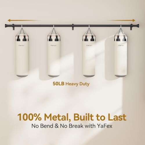 Black metal wall-mounted rod spanning full width, supporting four hanging punching bags. Text reads '50LB Heavy Duty' and '100% Metal, Built to Last - No Bend & No Break with YaFex'., 3+ more images are available