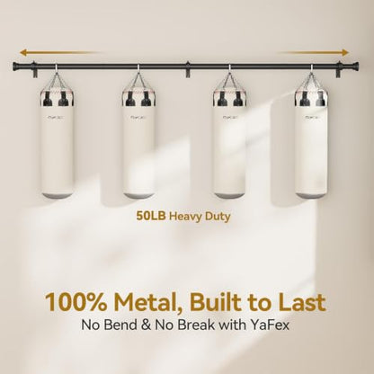 Black metal wall-mounted rod spanning full width, supporting four hanging punching bags. Text reads '50LB Heavy Duty' and '100% Metal, Built to Last - No Bend & No Break with YaFex'., 3+ more images are available
