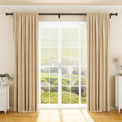 Black adjustable curtain rod mounted above a large white French door, holding two floor-length beige textured curtain panels. The dark metal rod spans the full width of the window with decorative finials at each end.